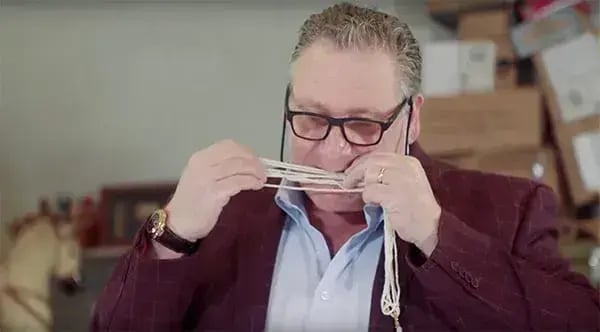 Antony Charman testing pearls with his teeth