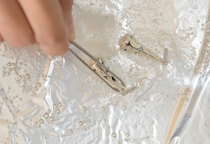 Cleaning silver with vinegar.